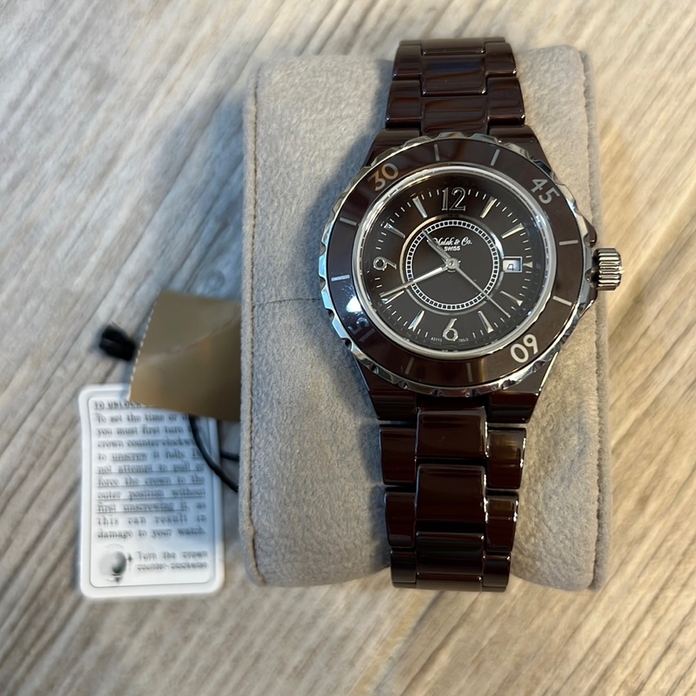 Ladies Malak Jewelers.brown ceramic watch, silver time markers, NWT,original box